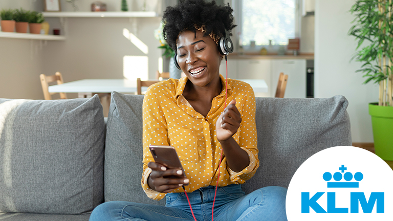 Happy woman is listening to music