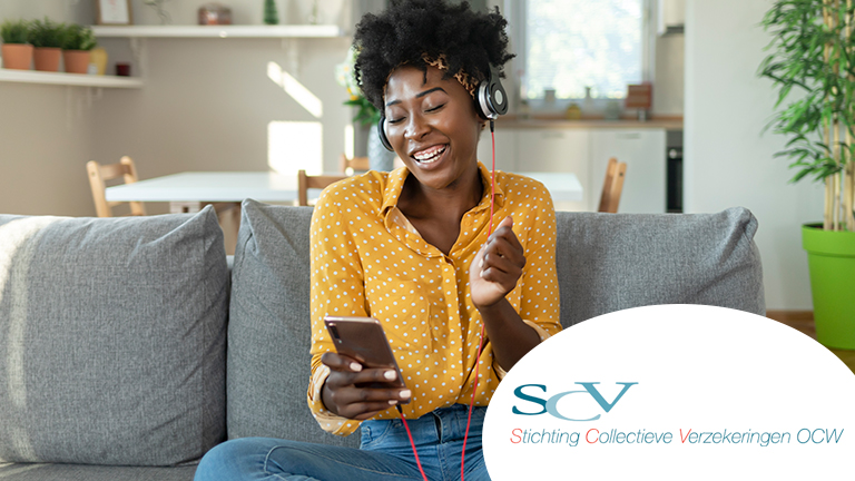 Happy woman is listening to music