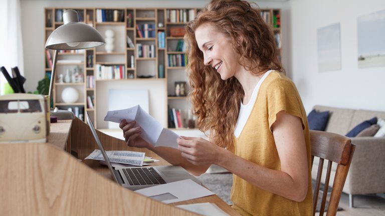 Woman checking some paper documents